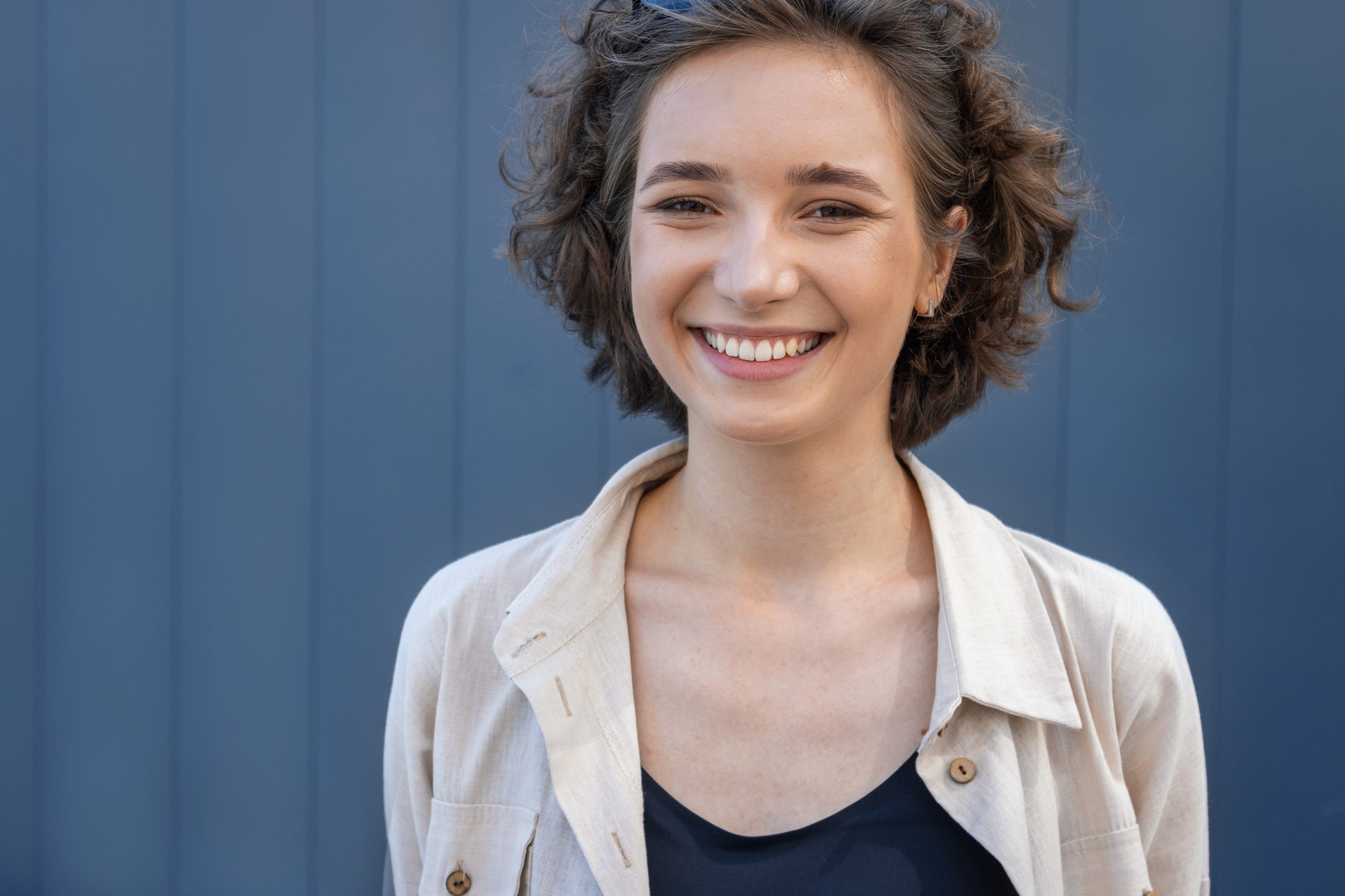 Young woman smiling, close up portrait