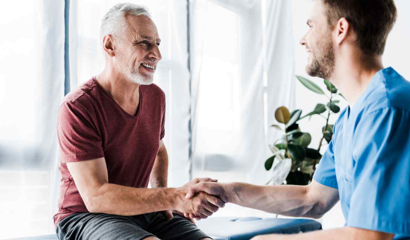 Patient shaking hands with doctor