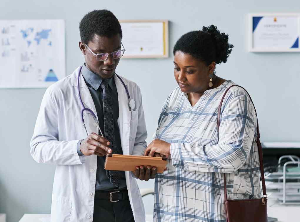 Doctor helping patient